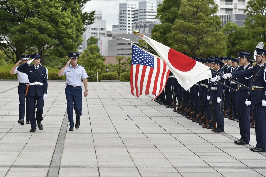 U.S. Air Force Gen. Terrence J. O’Shaughnessy, Pacific Air Forces commander, and Japan Air Self-Defense Force Gen. Yoshiyuki Sugiyama, chief of staff, salute the American and Japanese flag during an honor guard ceremony at the Japanese Ministry of Defense Aug. 8, 2016 in Tokyo, Japan. O’Shaughnessy’s visit to the Ministry of Defense was part of his first trip as COMPACAF in the Indo-Asia-Pacific region where he interacted with Airmen as well as Japanese dignitaries. (U.S. Air Force photo by Staff Sgt. Michael Washburn)