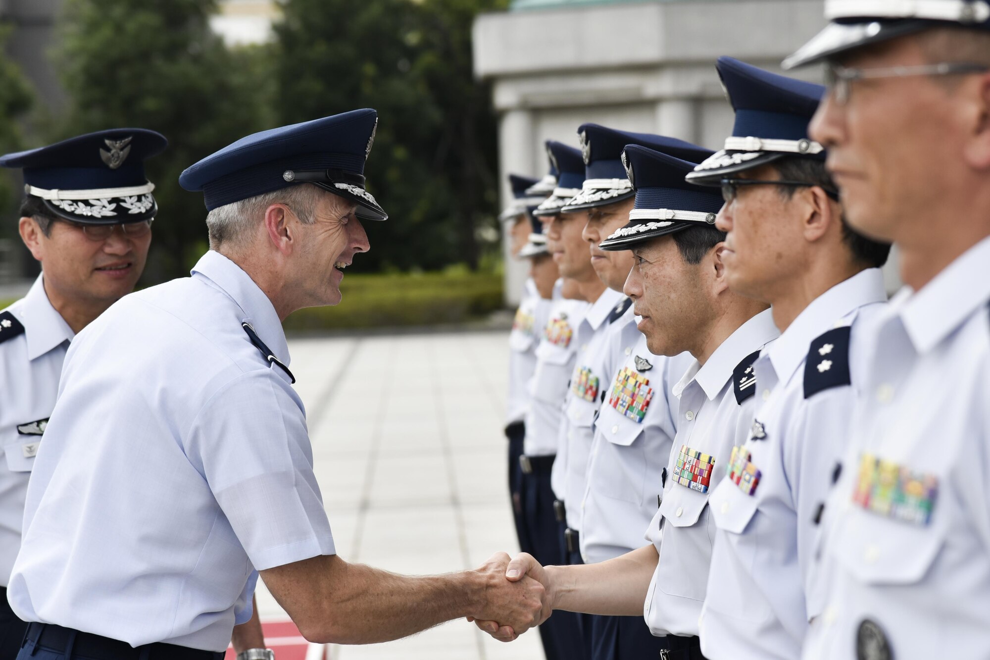 U.S. Air Force Gen. Terrence J. O’Shaughnessy, Pacific Air Forces commander, greets members of the Japanese Air Staff Office in Tokyo, Japan, Aug. 8, 2016, during his first trip as COMPACAF in the Indo-Asia-Pacific region. For the first time since taking command of PACAF, O’Shaughnessy also visited the Air Defense Command, U.S. Embassy and Japan’s Ministry of Defense. (U.S. Air Force photo by Staff Sgt. Michael Washburn)
