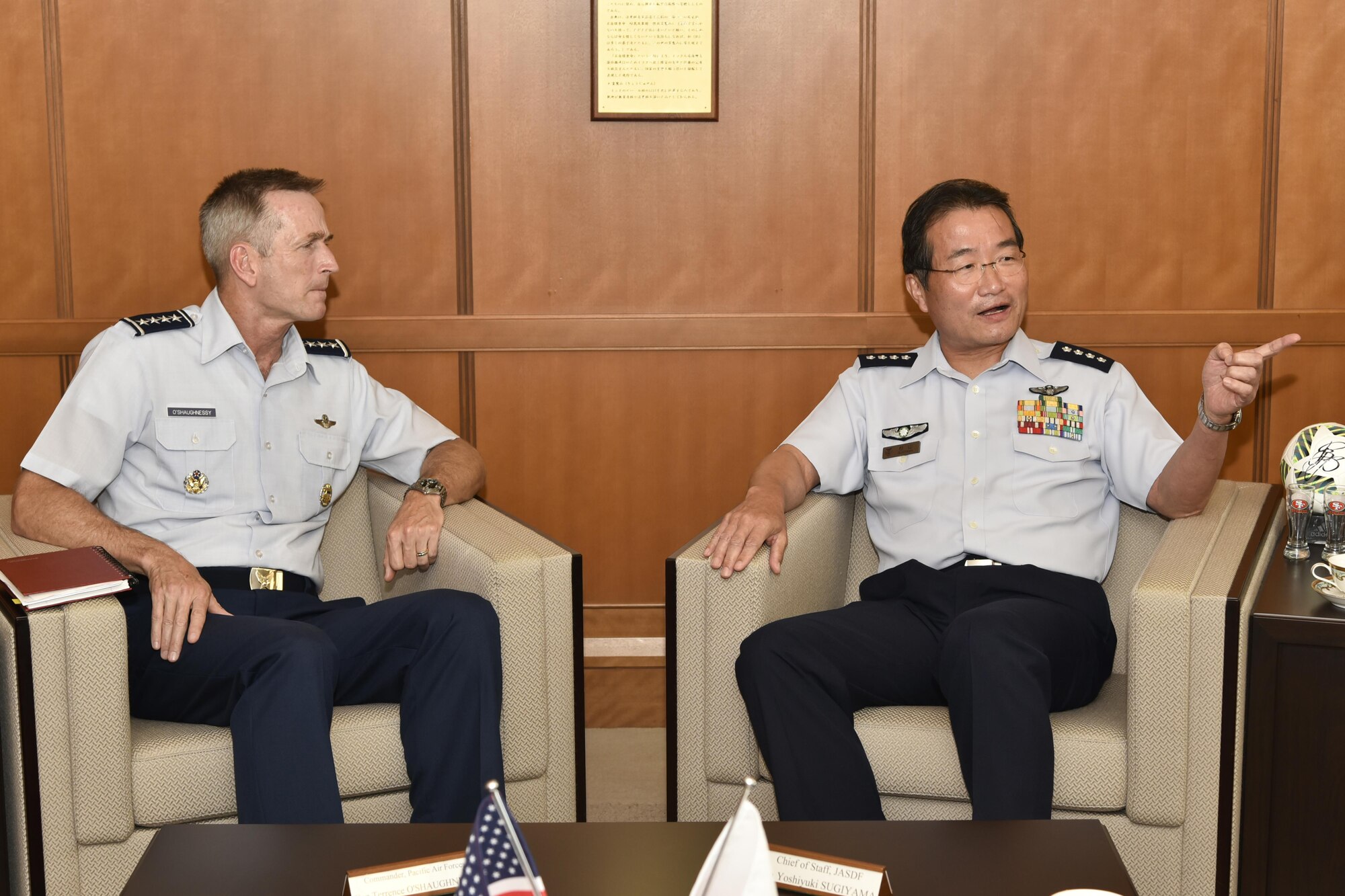 Gen. Terrence O’Shaughnessy, Pacific Air Forces commander, talks with Gen. Yoshiyuki Sugiyama, Japan Air Self-Defense Force chief of staff, at the Ministry of Defense in Tokyo, Japan, Aug. 8, 2016, during his immersion tour of the Indo-Asia Pacific Region. For the first time since taking command of PACAF, O’Shaughnessy visited the ADC, U.S. Embassy and Japan’s Ministry of Defense, along with a number of facilities at Yokota Air Base. (U.S. Air Force photo by Staff Sgt. Michael Washburn/Released)