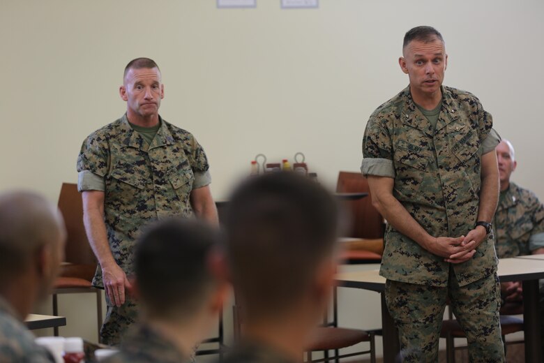 Sgt. Maj. Richard Thresher (left) and Brig. Gen. Matthew Glavy (right) share a few words with Marines assigned to Marine Air Control Group 28's Corporals Course after sharing a meal at the mess hall aboard Marine Corps Air Station Cherry Point, N.C., Aug. 9, 2016. Thresher and Glavy had breakfast with the Marines while discussing leadership and the role of noncommissioned officers in mission accomplishment for the Marine Corps. Thresher is the command sergeant major and Glavy is the commanding general for 2nd Marine Aircraft Wing. (U.S. Marine Corps photo by Lance Cpl. Mackenzie Gibson/Released)