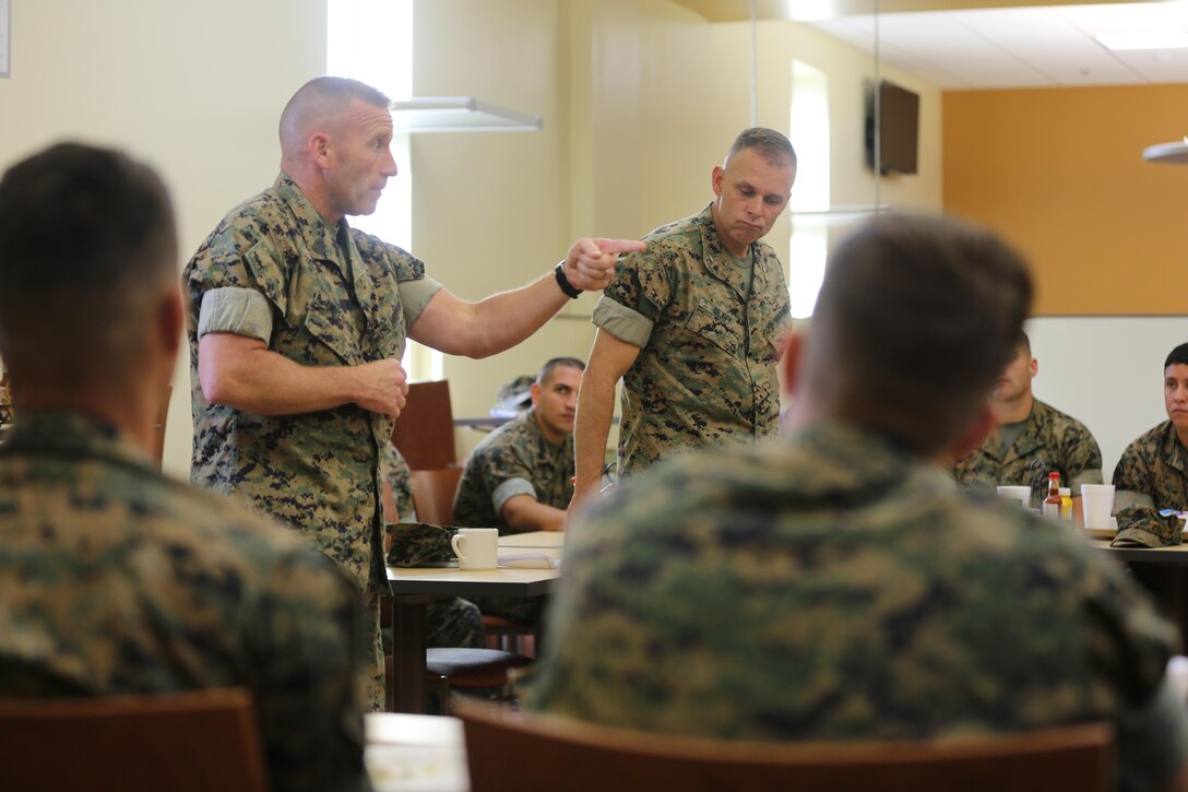 Sgt. Maj. Richard Thresher (left) and Brig. Gen. Matthew Glavy (right) share a few words with Marines assigned with Marine Air Control Group 28's Corporals Course after sharing a meal at the mess hall aboard Marine Corps Air Station Cherry Point, N.C., Aug. 9, 2016. Thresher and Glavy had breakfast with the Marines while discussing leadership and the role of noncommissioned officers in mission accomplishment for the Marine Corps. Thresher is the command sergeant major and Glavy is the commanding general for 2nd Marine Aircraft Wing. (U.S. Marine Corps photo by Lance Cpl. Mackenzie Gibson/Released)