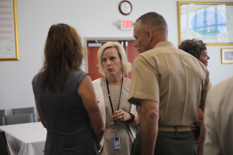 Meghan Doyle, superintendent of Craven County (center), converses with Brig. Gen. Matthew Glavy (right) and his wife, Francine, (left) during a meet-and-greet at the City Hall in Havelock, N.C., Aug. 9, 2016. Col. Todd Ferry, commanding officer for Marine Corps Air Station Cherry Point, also attended as a representative. “It is important to make a connection with the community, especially when it comes to our children’s education,” said Glavy. Glavy also stated he attended the meet-and-greet because he values the relationship between the Marines and the kids in the community. “We are fortunate to have the military influence on the surrounding area because it brings culture to our school system,” said Doyle. Glavy is the commanding general for 2nd Marine Aircraft Wing and Doyle is the superintendent for Craven County. (U.S. Marine Corps photo by Lance Cpl. Mackenzie Gibson/Released)
