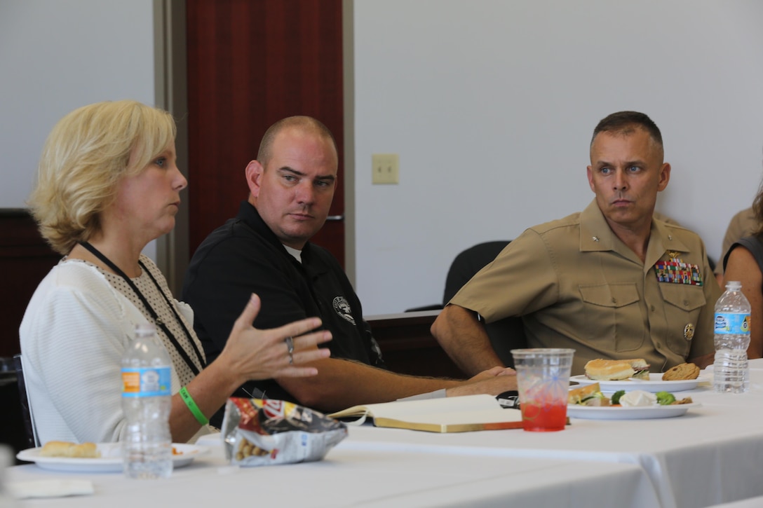 Meghan Doyle, superintendent of Craven County (left) answers questions from city representatives as Havelock Mayor William Lewis (center) and Brig. Gen. Matthew Glavy (right) listen during a meet-and-greet at the city hall in Havelock, N.C., Aug. 9, 2016. Col. Todd Ferry, commanding officer for Marine Corps Air Station Cherry Point, also attended as a representative. “It is important to make a connection with the community, especially when it comes to our children’s education,” said Glavy. Glavy also stated he attended the meet-and-greet because he values the relationship between the Marines and the kids in the community. “We are fortunate to have the military influence on the surrounding area because it brings culture to our school system,” said Doyle. Glavy is the commanding general for 2nd Marine Aircraft Wing and Doyle is the superintendent for Craven County. (U.S. Marine Corps photo by Lance Cpl. Mackenzie Gibson/Released)