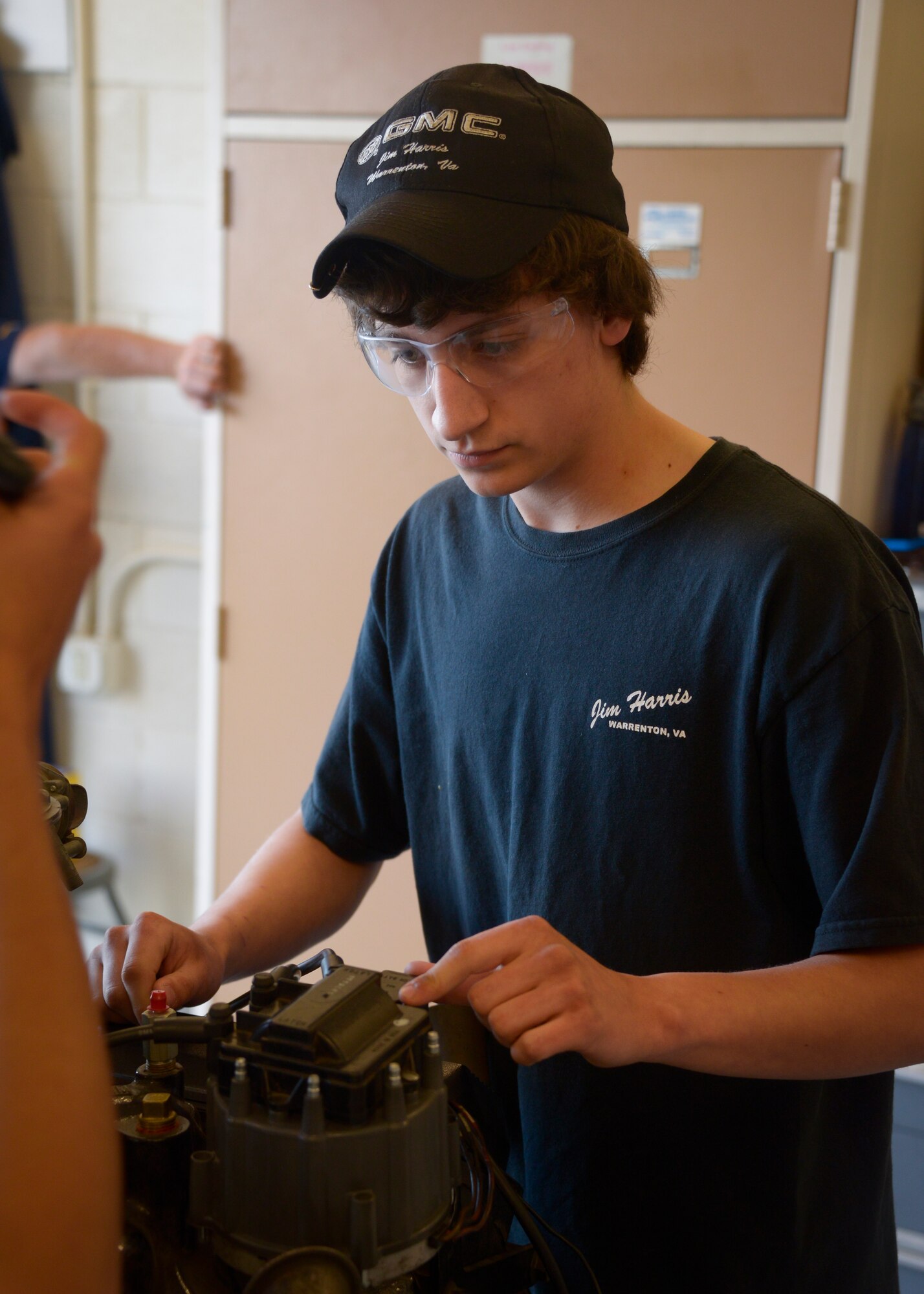 Student competes with team in the engine diagnostic competition during the annual Top Wrench competition July, 14. Top Wrench gives students the chance to compete in 6 different categories and take a tour around the base to see static displays of military aircraft, vehicles and weapons. (U.S. Air National Guard photo by Staff Sgt. Ben Mellon)