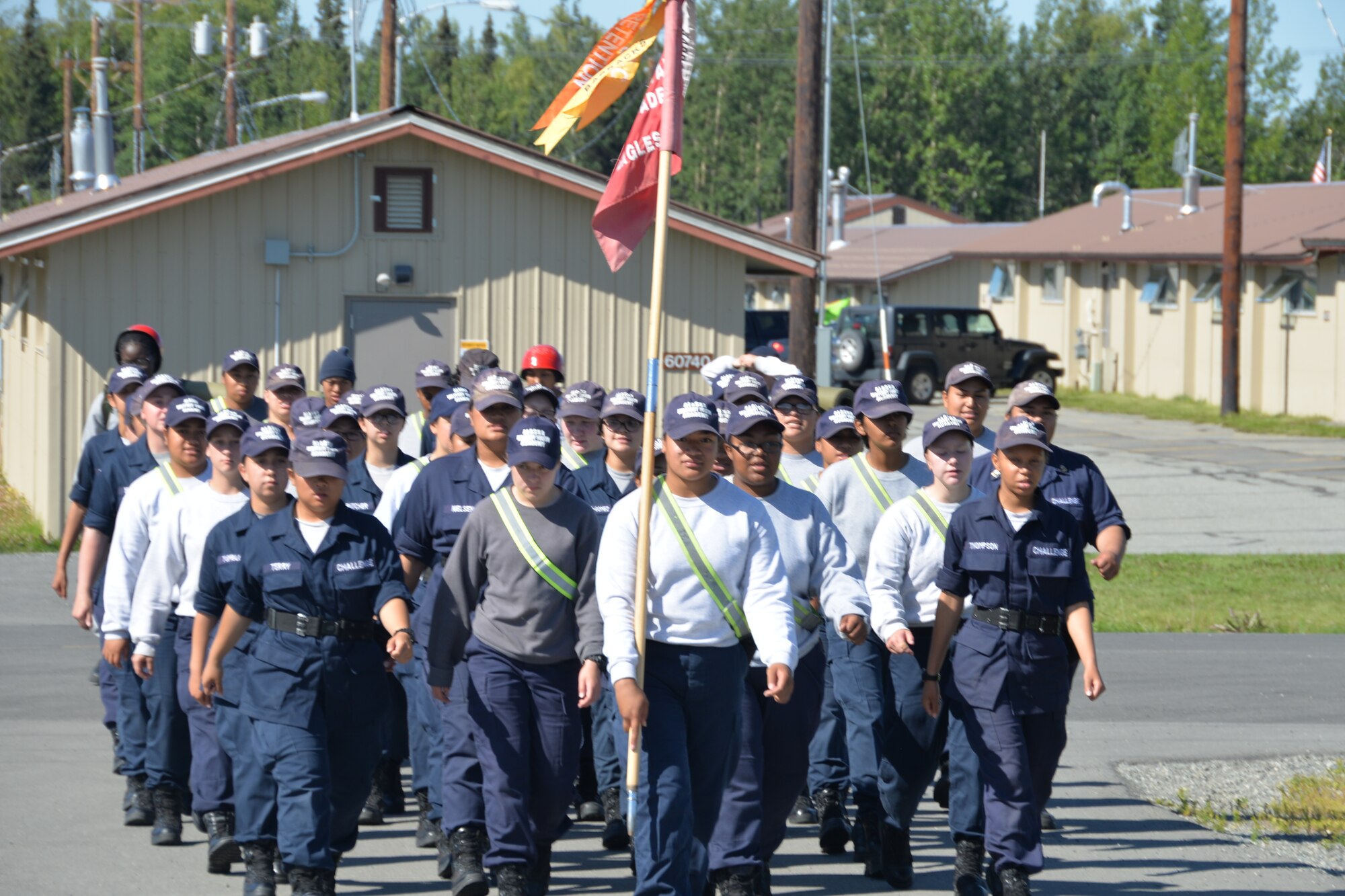 A platoon of cadets from the Military Youth Academy marches to the dining facility at Joint Base Elmendorf- Richardson, Alaska on July 14. The Cadets voluntarily live in military like conditions for 22 weeks in order to get back on the right track to earn high school credits, GED or high school diploma. (U.S. Air National Guard photo by: Senior Airman Melissa Dearstone)