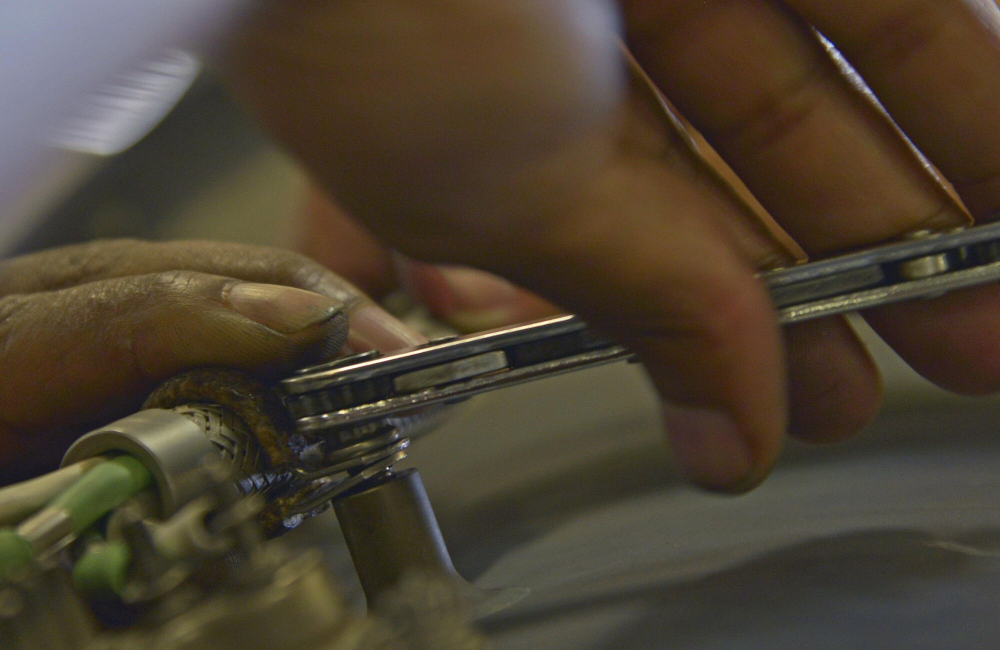 Staff Sgt. Jonathan Thomas, 374th Maintenance Squadron aerospace propulsion flight craftsman, installs a thermocouple harness bracket onto an engine at Yokota Air Base, Japan, Aug. 11, 2016. The propeller section creates propellers and performs routine maintenance, fixing leaks and replacing seals on the propellers. (U.S. Air Force photo by Senior Airman David Owsianka/Released)
