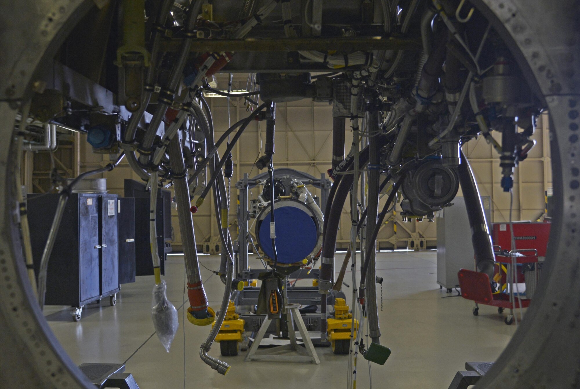 An engine and quick engine change kit sit in the 374th Maintenance Squadron aerospace propulsion flight warehouse at Yokota Air Base, Japan, Aug. 11, 2016. To effectively repair engines and propellers, the propulsion flight is separated into four sections: jet engine intermediate maintenance, propeller, test cell and kits. (U.S. Air Force photo by Senior Airman David Owsianka/Released)