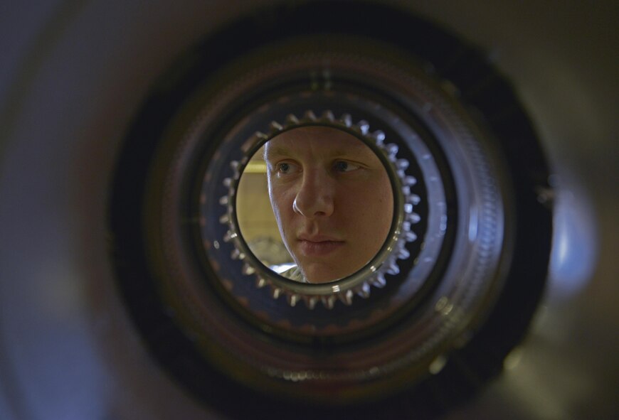Airman 1st Class Brian Reese, 374th Maintenance Squadron aerospace propulsion flight journeyman, tightens bolts prior to performing maintenance on a propeller at Yokota Air Base, Japan, Aug. 11, 2016. The propeller section creates propellers and performs routine maintenance work by fixing any leaks and replacing seals. (U.S. Air Force photo by Senior Airman David Owsianka/Released)