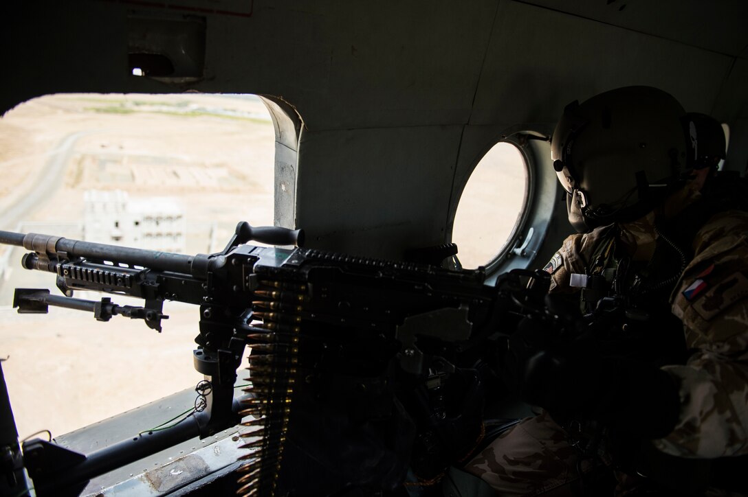 Czech Republic Air Force Airmen assemble their gear in preparation for a sortie in the Mi-17 at Hamid Karzai International Airport, Kabul, Afghanistan, Aug. 11, 2016. Coalition forces assigned to the Train, Advise, Assist Command-Air (TAAC-Air) are assisting the Afghan air force in developing a professional, capable, and sustainable Air Force. The Czech Republic Airmen are assigned to the 311th Air Expeditionary Advisory Squadron. (U.S. Air Force photos by Staff Sgt. Larry E. Reid Jr.)