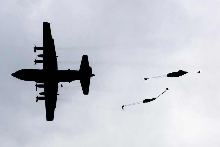 U.S. Army paratroopers perform an airborne insertion from a C-130 Hercules during Red Flag-Alaska at Joint Base Elmendorf-Richardson, Alaska, Aug 10, 2016. After a four-hour flight through simulated enemy controlled territory 80 soldiers jumped from multiple aircraft to control the drop zone. (U.S. Air Force photo by Staff Sgt. Michael Smith/Released)