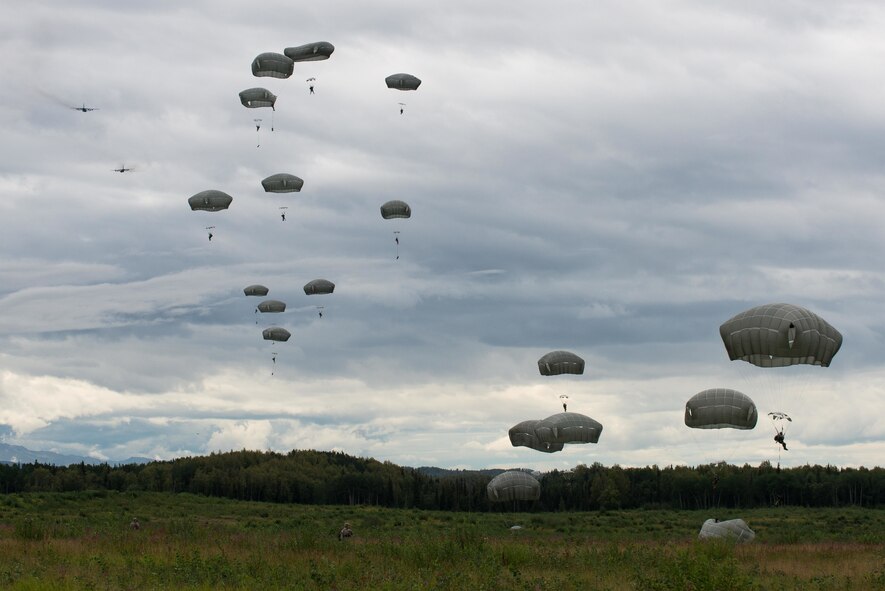 U.S. Army paratroopers perform an airborne insertion from two C-130 Hercules during Red Flag-Alaska at Joint Base Elmendorf-Richardson, Alaska, Aug 10, 2016. Exercises such as this are one of the many ways C-130 crews get to prepare themselves for real-world contingencies. (U.S. Air Force photo by Staff Sgt. Michael Smith/Released)