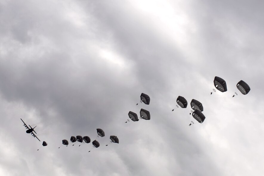 U.S. Army paratroopers perform an airborne insertion from a C-130 Hercules during Red Flag-Alaska at Joint Base Elmendorf-Richardson, Alaska, Aug 10, 2016. The 80 soldiers had 30 seconds to leave the multiple aircraft in order to land safely in the designated area. (U.S. Air Force photo by Staff Sgt. Michael Smith/Released)