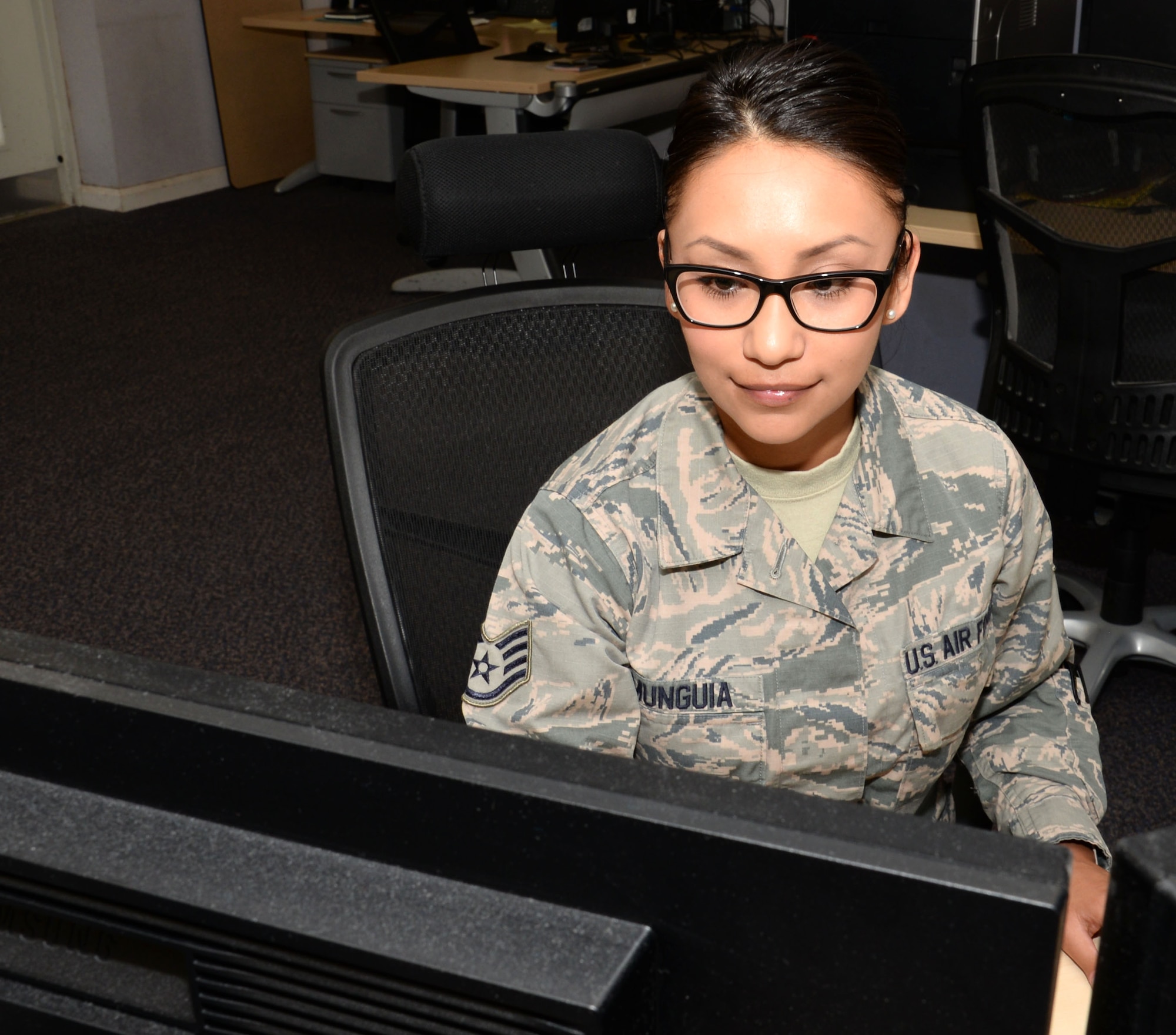 U.S. Air Force Air Force Staff. Sgt. Marissa Munguia, 100th Operations Support Squadron weather forecaster, produces a forecast for a KC-135 Stratotanker crew departing the base Aug. 8, 2016, on RAF Mildenhall, England. Munguia builds a forecast to evaluate any hazards during their flight. (U.S. Air Force photo by Gina Randall)