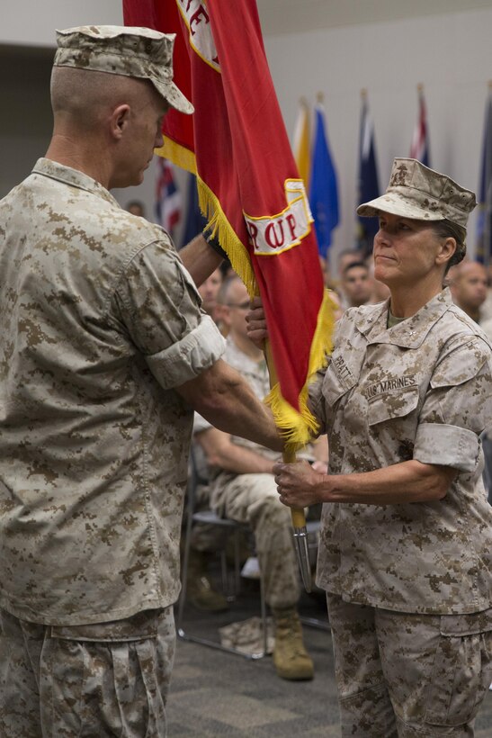 Brig. Gen. Helen G. Pratt (right), incoming commander of 4th Marine Logistics Group, receives the colors from Brig. Gen. Patrick J. Hermesmann (left), former commander of 4th MLG, during the change of command ceremony at the Federal City Auditorium, New Orleans, Aug. 13, 2016. While addressing the attendees of the ceremony, Hermessman expressed his total confidence in Pratt as the new commander. (U.S. Marine Corps photo by Lance Cpl. Melissa Martens/ Released)