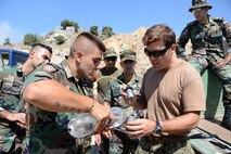 Lt. Stephen Honan, right, assigned to Commander, Task Group (CTG) 56.1, conducts demolition training with members of the Lebanese armed forces during Resolute Response 16 outside of Beirut, Lebanon, Aug. 12, 2016. Resolute Response 16 is an annual bilateral EOD, diving and Visit, Board, Search and Seizure exercise with the U.S. Navy, U.S. Coast Guard and Lebanese Armed Forces.