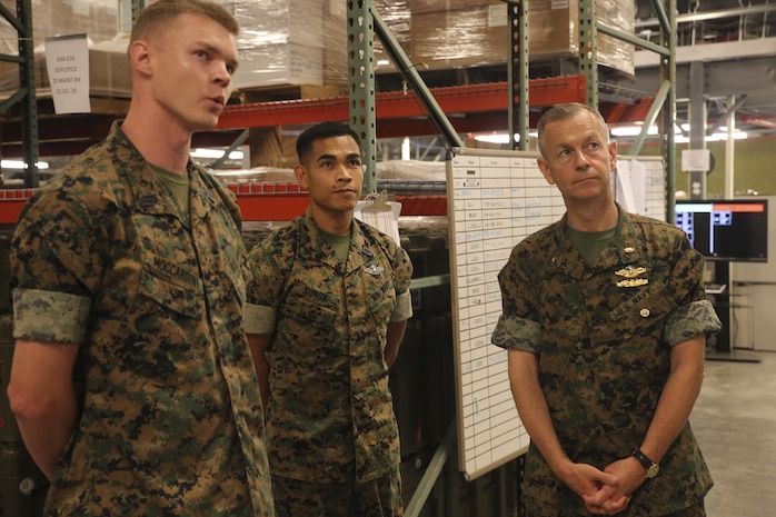 Hospitalman Matthew Moccardini, left, a warehouse clerk with 2nd Medical Logistics Company, 2nd Maintenance Battalion, briefs Navy Rear Adm. Stephen Pachuta, right, the Medical Officer of the Marine Corps, on the unit’s equipment at Camp Lejeune, N.C., Aug. 11. Pachuta visited several units throughout II Marine Expeditionary Force as well as the Camp Lejeune and Cherry Point Naval Hospitals to assess medical readiness. (U.S. Marine Corps photo by Sgt. Lucas Hopkins)