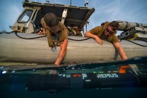 Mineman 1st Class Coy Tully, left, and Mineman 3rd Class Pete Calvert, assigned to Commander, Task Group 56.1, launch a MK 18 MOD 1 unmanned underwater vehicle from a rigid-hull inflatable boat during Squadex 2016. Squadex 2016 demonstrates U.S./U.K. mine detection capabilities in the U.S. 5th Fleet area of operations. 