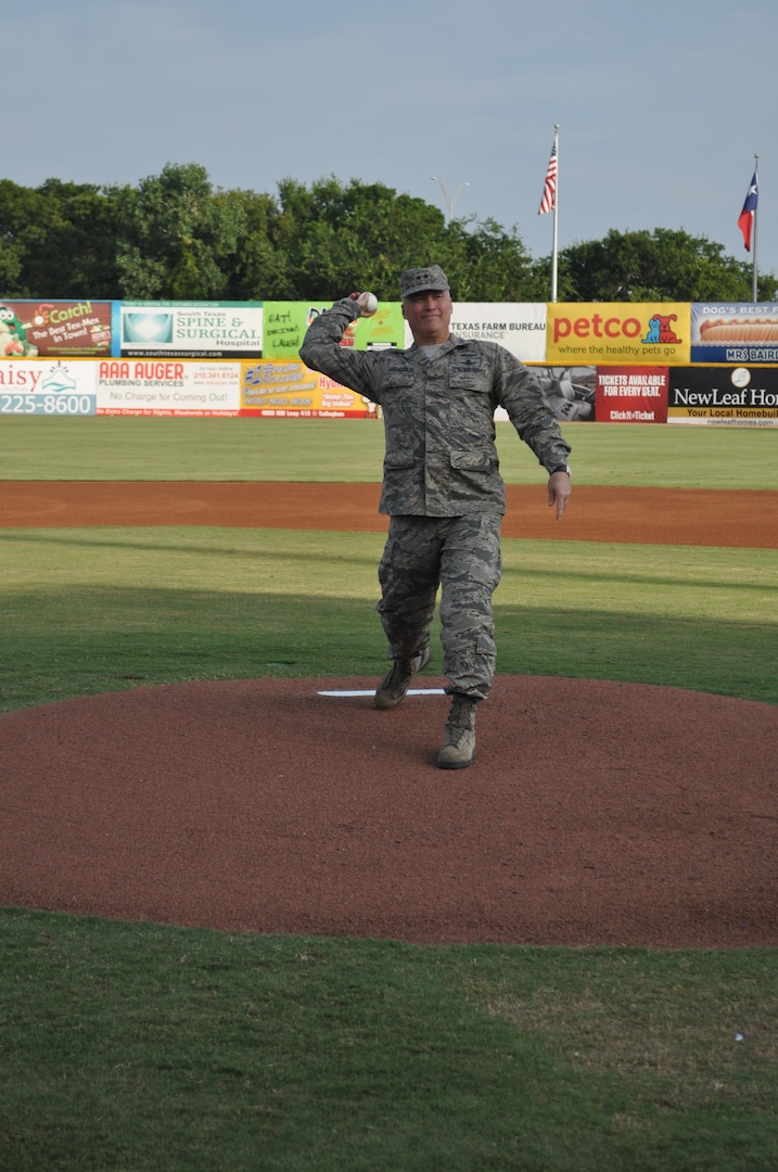 Maj. Gen. James K. McLaughlin, 24th Air Forces’ third commander, throws the first pitch during a minor league baseball game between the San Antonio Missions and the San Diego Padres in San Antonio July 2013 (Courtesy photo). 