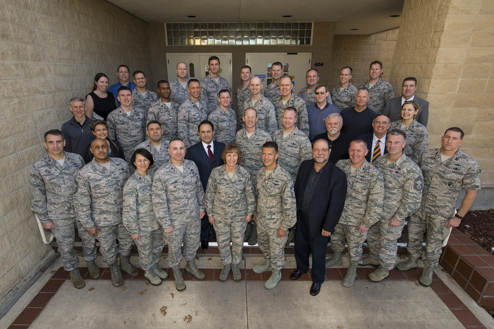 The 688th Cyberspace Wing poses for a group photo 27 Jan 2016. Under 24th Air Force, the 688th is mission critical in denying adversaries freedom to maneuver on cyber key terrain (U.S. photo by MSgt Luke Thelen). 