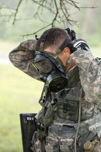 U.S. Army Pfc. Jevonie Ortiz, 411th Chemical Company, Edison, N.J., equips protective equipment during a decontamination training exercise as part of a Combat Support Training Exercise at Fort McCoy, Wis., August 12, 2016. The 84th Training Command’s third and final Combat Support Training Exercise of the year hosted by the 86th Training Division at Fort McCoy, Wis. is a multi-component and joint endeavor aligned with other reserve component exercises. (U.S. Army photo by Sgt. Robert Farrell/Released)