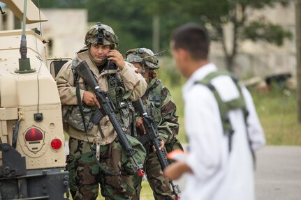 U.S. Army Spc. Steven Peralta, Sgt. Amanda Gaderon, 411th Chemical Company, Edison, N.J., call for support for a potential chemical device during a Combat Support Training Exercise at Fort McCoy, Wis., August 12, 2016. The 84th Training Command’s third and final Combat Support Training Exercise of the year hosted by the 86th Training Division at Fort McCoy, Wis. is a multi-component and joint endeavor aligned with other reserve component exercises. (U.S. Army photo by Sgt. Robert Farrell/Released)