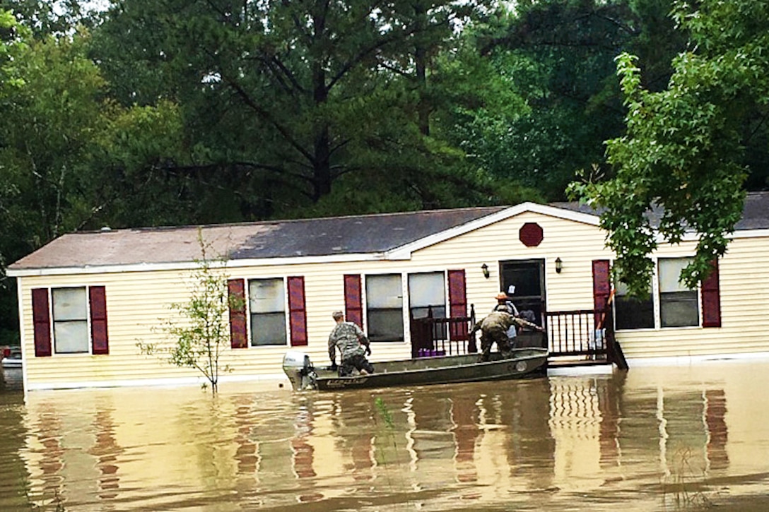 Soldiers conduct evacuations by boat during severe flooding in Tangipahoa parish, Tickfaw, La., Aug. 13, 2016. The soldiers are assigned to the Louisiana National Guard’s 225th Engineer Brigade. Army National Guard photo  