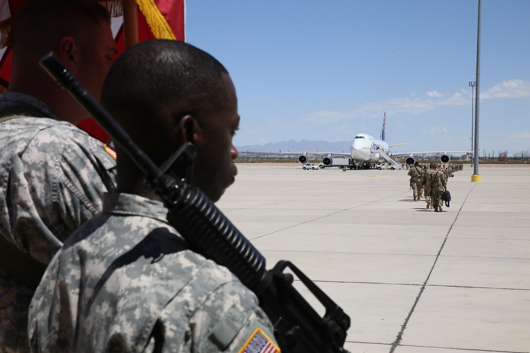 Soldiers assigned to the 368th Eng. Bn. and the 475th Eng. Co., both U.S. Army Reserve, board a flight to U.S. Central Command at the Silas L. Copeland Arrival/Departure Airfield Control Group here July 20.