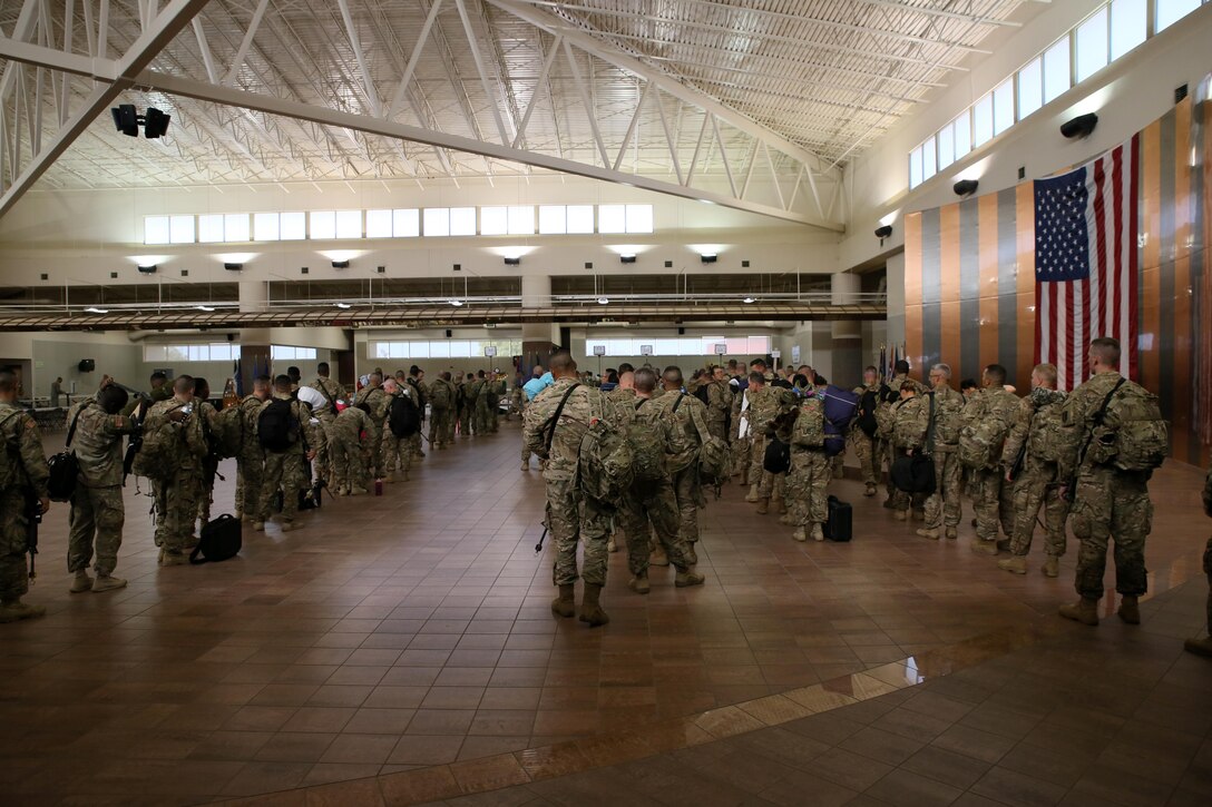 Soldiers assigned to the 368th Eng. Bn. and the 475th Eng. Co., both U.S. Army Reserve, are weighed, manifested and processed prior to boarding a flight to U.S. Central Command at the Silas L. Copeland Arrival/Departure Airfield Control Group here July 20.