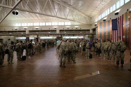 Soldiers assigned to the 368th Eng. Bn. and the 475th Eng. Co., both U.S. Army Reserve, are weighed, manifested and processed prior to boarding a flight to U.S. Central Command at the Silas L. Copeland Arrival/Departure Airfield Control Group here July 20.