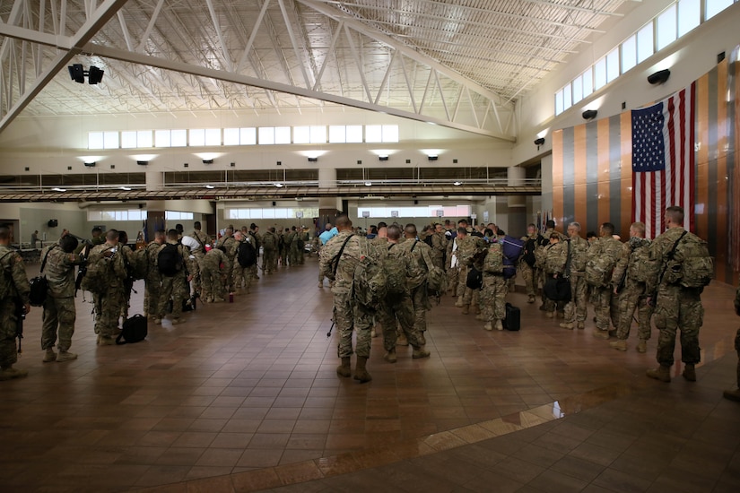 Soldiers assigned to the 368th Eng. Bn. and the 475th Eng. Co., both U.S. Army Reserve, are weighed, manifested and processed prior to boarding a flight to U.S. Central Command at the Silas L. Copeland Arrival/Departure Airfield Control Group here July 20.