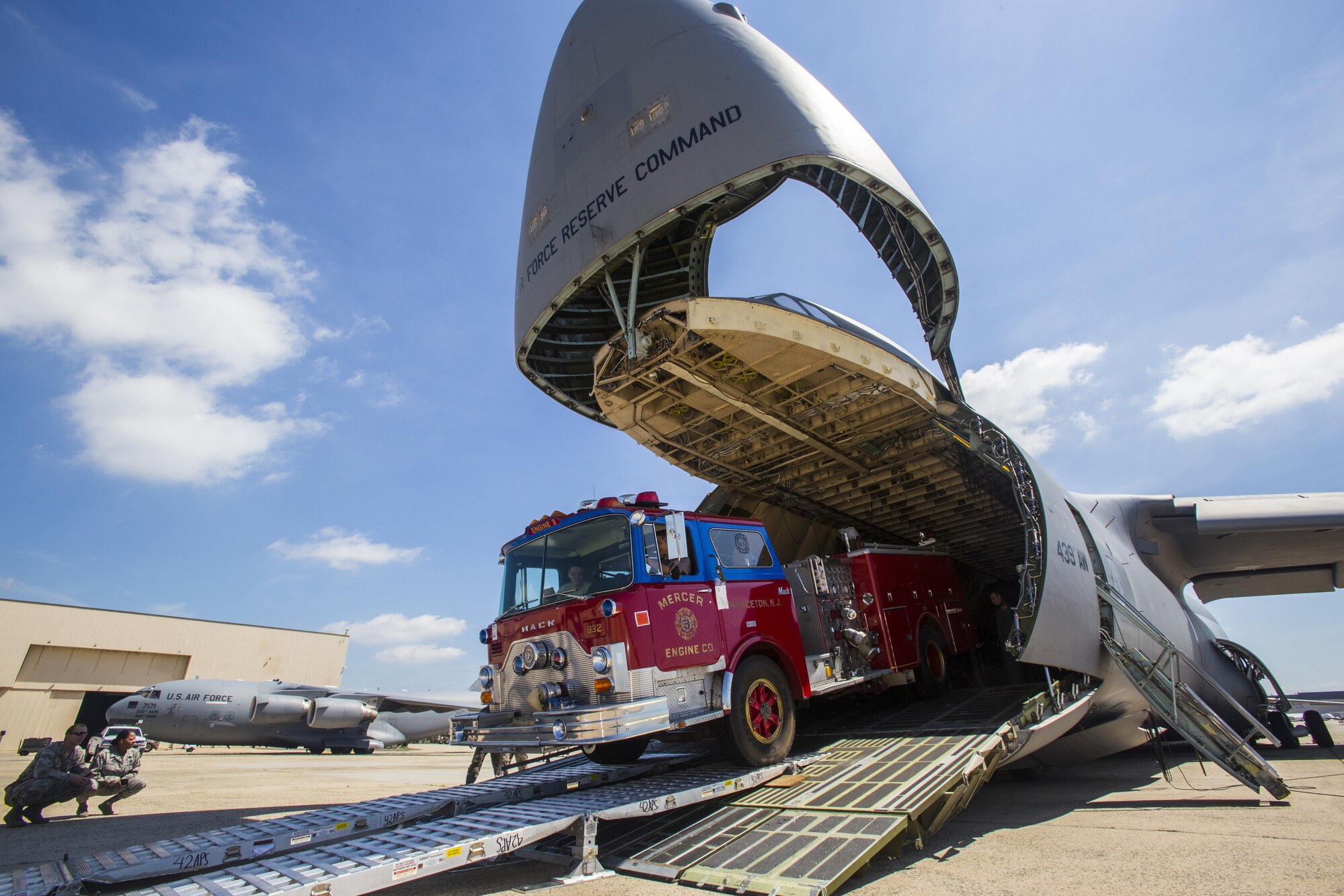 Loadmasters with the 439th Airlift Wing, Air Force Reserve Command, load a 1982 Mack 1250 GPM pumper fire truck onto a C-5B Galaxy at Joint Base McGuire-Dix-Lakehurst N.J., on Aug. 12, 2016. The truck will be flown to Managua, Nicaragua. Master Sgt. Jorge A. Narvaez, a New Jersey Air National Guardsman with the 108th Security Forces Squadron, was instrumental in getting the truck donated to a group of volunteer firefighters in Managua. The 439th AW is located at Westover Air Reserve Base, Mass.