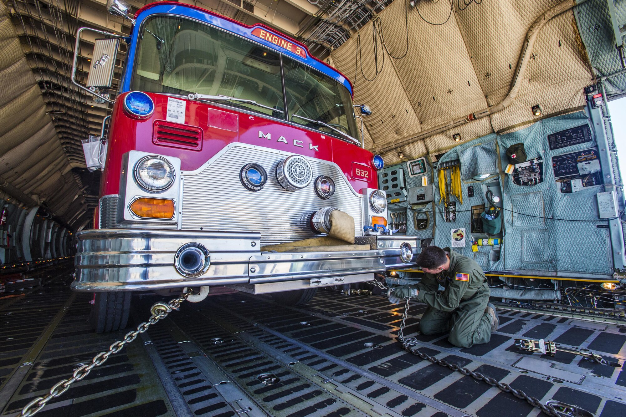 Loadmasters with the 439th Airlift Wing load a 1982 Mack fire truck onto a C-5B Galaxy at Joint Base McGuire-Dix-Lakehurst N.J., on Aug. 12, 2016. The truck will be flown to Managua, Nicaragua. Master Sgt. Jorge A. Narvaez, a New Jersey Air National Guardsman with the 108th Security Forces Squadron, was instrumental in getting the truck donated to a group of volunteer firefighters in Managua. The 439th AW is located at Westover Air Reserve Base, Mass.