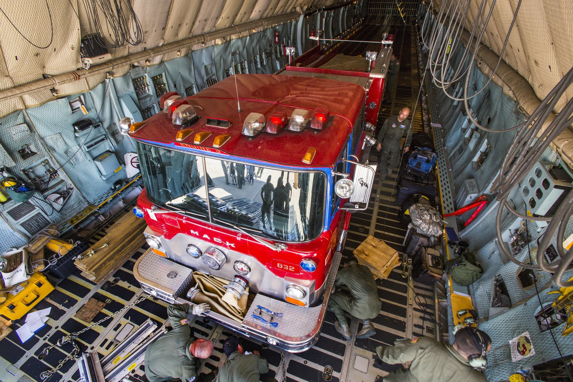 Loadmasters with the 439th Airlift Wing secure a 1982 Mack  fire truck onto a C-5B Galaxy at Joint Base McGuire-Dix-Lakehurst N.J., on August 12, 2016. The truck will be flown to Managua, Nicaragua. Master Sgt. Jorge A. Narvaez, a traditional New Jersey Air National Guardsman with the 108th Security Forces Squadron, was instrumental in getting the truck donated to a group of volunteer firefighters in Managua. The truck donation is done through the Denton Program, which allows U.S. citizens and organizations to use space available on military cargo aircraft to transport humanitarian goods to countries in need. The 439th is located at Westover Air Reserve Base, Mass.