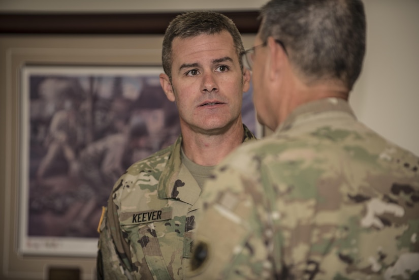 Sgt. 1st Class Bill Keever, Arizona State University ROTC assistant primary military science instructor speaks with Maj. Gen. Mark McQueen, 108th Training Command (IET) commanding general, during a senior leader seminar held at Joint Base Lewis McChord, Wash., Aug. 6. Sixty-seven Military Science Instructors from 150 Universities spread throughout 26 states were present during the seminar as part of an annual training development event designed to tap into senior leader mentoring and motivational techniques as well as provide a forum for the exchange of ideas and best practices. The event was hosted by the 104th Training Division's 4th Battalion, 414th Regiment (SROTC). (U.S. Army Reserve photo by Sgt. 1st Class Brian Hamilton)