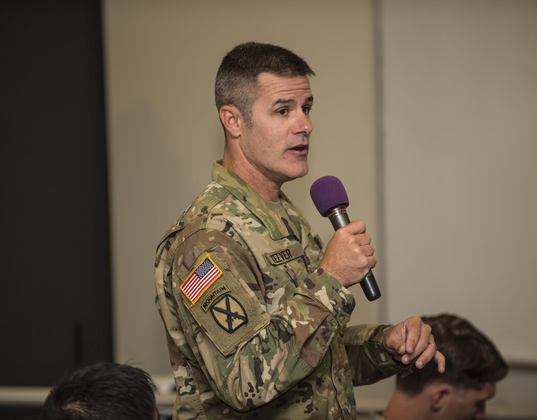 Sgt. 1st Class Bill Keever, Arizona State University ROTC assistant primary military science instructor, asks a question about career progression, during a senior leader seminar held at Joint Base Lewis McChord, Wash., Aug. 6. Sixty-seven Military Science Instructors from 150 Universities spread throughout 26 states were present during the seminar as part of an annual training development event designed to tap into senior leader mentoring and motivational techniques as well as provide a forum for the exchange of ideas and best practices. The event was hosted by the 104th Training Division's 4th Battalion, 414th Regiment (SROTC). (U.S. Army Reserve photo by Sgt. 1st Class Brian Hamilton)