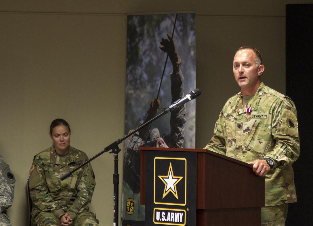 Lt. Col. Antony Griffin, outgoing commander of the 4th Training Support Battalion (ROTC) 413th Regiment of the 104th Training Division gives guidance, gratitude and farewell to Soldiers and families during a change of command ceremony held at General George Patton Museum of Leadership, Ft. Knox, Kentucky, Aug. 8. (U.S. Army Reserve photo by Sgt. Karen Sampson/ Released)