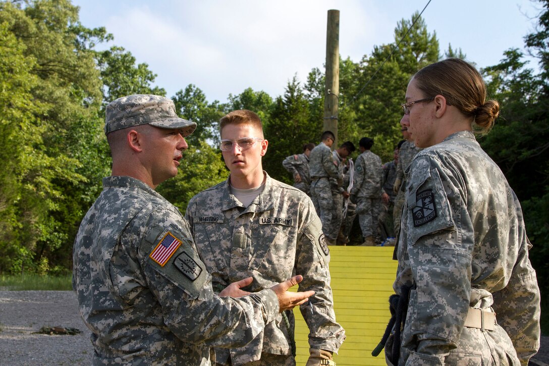 Task Force Wolf instructor Army Reserve Staff Sgt. Kevin L. Fischer, mentors Cadet Initial Entry Training (CIET) candidates about safety while accomplishing obstacle 7, The Cliff-Hanger, on the Field Leaders Reaction Course (FLRC), during Cadet Summer Training (CST16), at Ft. Knox, Kentucky June 16. (U.S. Army Reserve photo by Sgt. Karen Sampson/ Released)