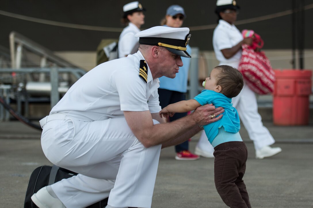 A sailor reunites with his family in Bremerton, Wash., after returning home from a seven-month deployment to the Asia-Pacific aboard the USS John C. Stennis, Aug. 14, 2016. Navy photo by Petty Officer Cole C. Pielop
