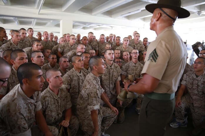 Recruits from Delta Company, 1st Recruit Training Battalion, receive instructions from a drill instructor during pick up at Marine Corps Recruit Depot San Diego, Aug. 12. The recruits will spend their first day with their drill instructors learning the rules and regulations of recruit training, regarding everything from how to act in the squad bay to how to speak to drill instructors. Annually, more than 17,000 males recruited from the Western Recruiting Region are trained at MCRD San Diego. Delta Company is scheduled to graduate Nov. 4.