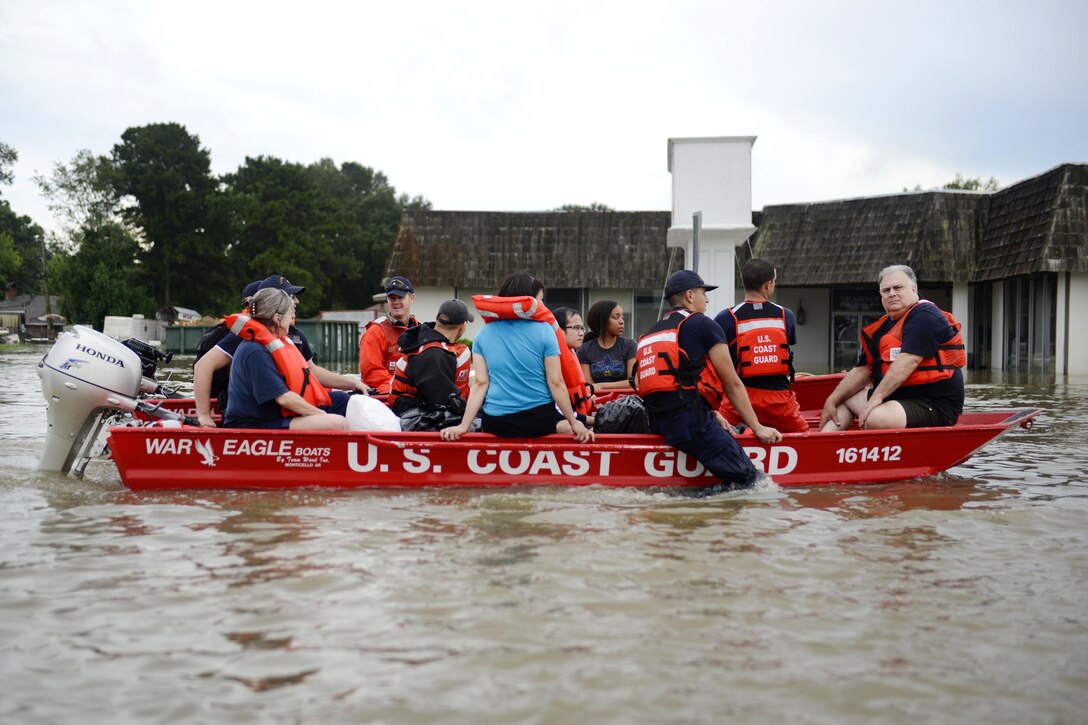 Coast Guardsmen rescue stranded residents from high water during severe flooding around Baton Rouge, La., Aug. 14, 2016. Coast Guard photo by Petty Officer 3rd Class Brandon Giles