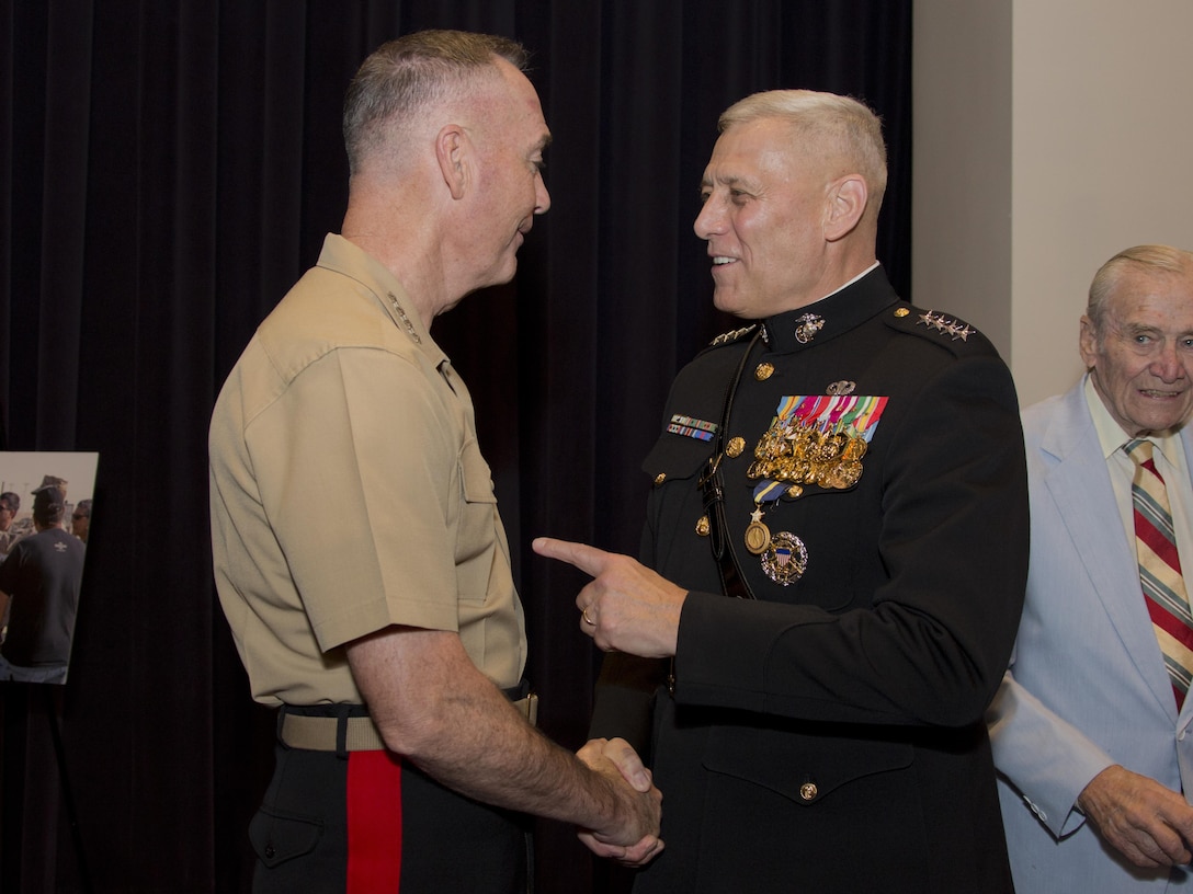 U.S. Marine Corps Gen. John M. Paxton Jr., 33rd assistant commandant of the Marine Corps, speaks with Gen. Joseph F. Dunford, chairman, Joint Chiefs of Staff, after his retirement ceremony at Marine Barracks Washington, Washington, D.C., Aug. 4, 2016. Paxton retired after serving 42 years in the Marine Corps. (U.S. Marine Corps photo by Lance Cpl. Hailey D. Stuart)


