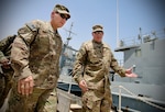 Maj. Gen. Edward Dorman, J-4 (logistics), U.S. Army Central Command, looks out over the pier aboard the Large Tug U.S. Army Vessel Col. Seth Warner during his visit to the 401st Army Field Support Battalion-Kuwait’s Army Prepositioned Stocks-5 watercraft set at Kuwait Naval Base, Aug. 3. (Photo by Justin Graff, 401st AFSB Public Affairs)
