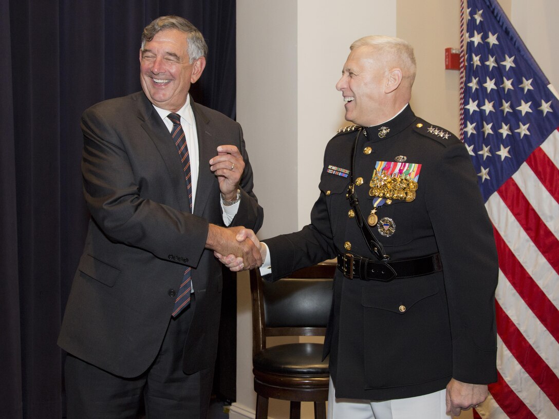 U.S. Marine Corps Gen. John M. Paxton Jr., 33rd assistant commandant of the Marine Corps, speaks with a guest after his retirement ceremony at Marine Barracks Washington, Washington, D.C., Aug. 4, 2016. Paxton retired after serving 42 years in the Marine Corps. (U.S. Marine Corps photo by Lance Cpl. Hailey D. Stuart)