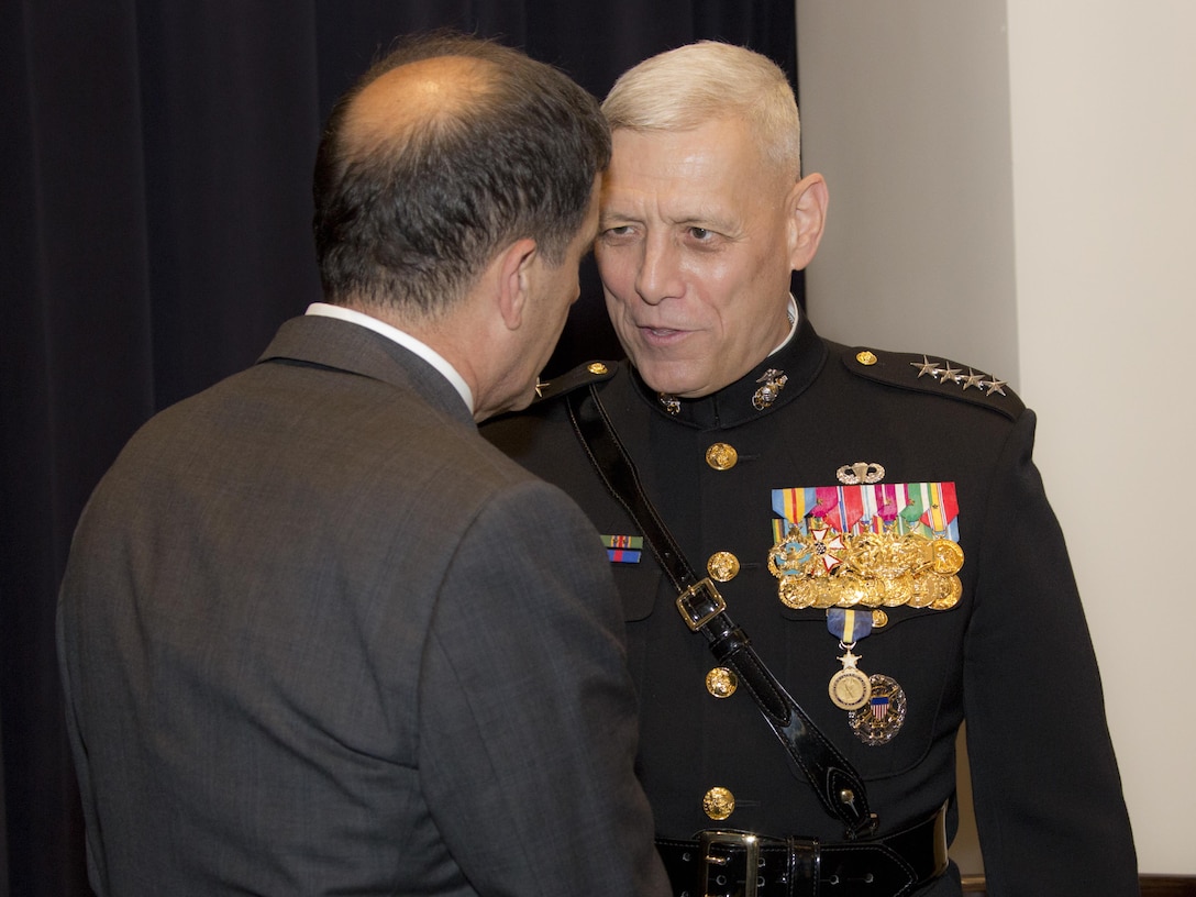 U.S. Marine Corps Gen. John M. Paxton Jr., 33rd assistant commandant of the Marine Corps, speaks with a guest after his retirement ceremony at Marine Barracks Washington, Washington, D.C., Aug. 4, 2016. Paxton retired after serving 42 years in the Marine Corps. (U.S. Marine Corps photo by Lance Cpl. Hailey D. Stuart)