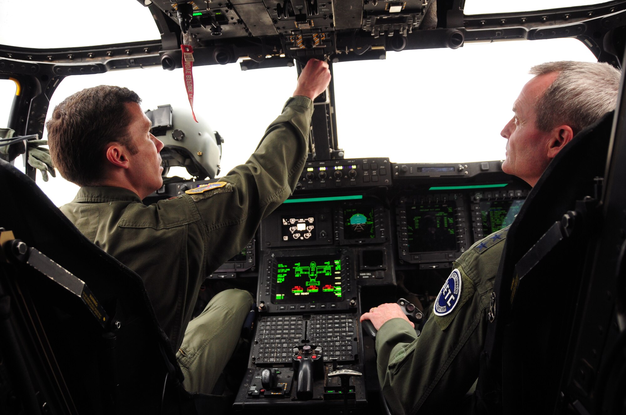 Lt. Gen. Darryl Roberson, Air Education and Training Command commander, is given an overview of the controls of the CV-22, by Major Travis Burns, a pilot, with the 58th Special Operations Wing, Aug. 5. Roberson was given an overview of the aircraft and its capabilities. (Photo by Master Sgt. Paula Aragon)