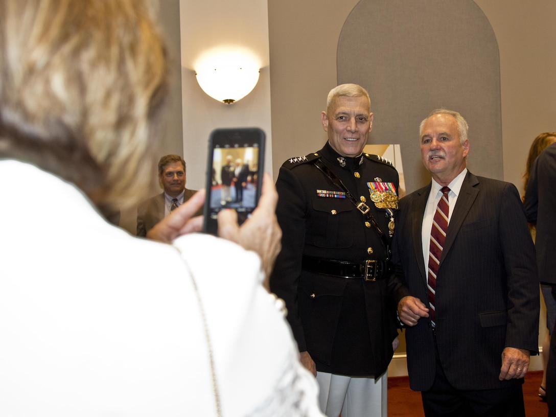 U.S. Marine Corps Gen. John M. Paxton Jr., 33rd assistant commandant of the Marine Corps, speaks with a guest after his retirement ceremony at Marine Barracks Washington, Washington, D.C., Aug. 4, 2016. Paxton retired after serving 42 years in the Marine Corps. (U.S. Marine Corps photo by Lance Cpl. Hailey D. Stuart)

