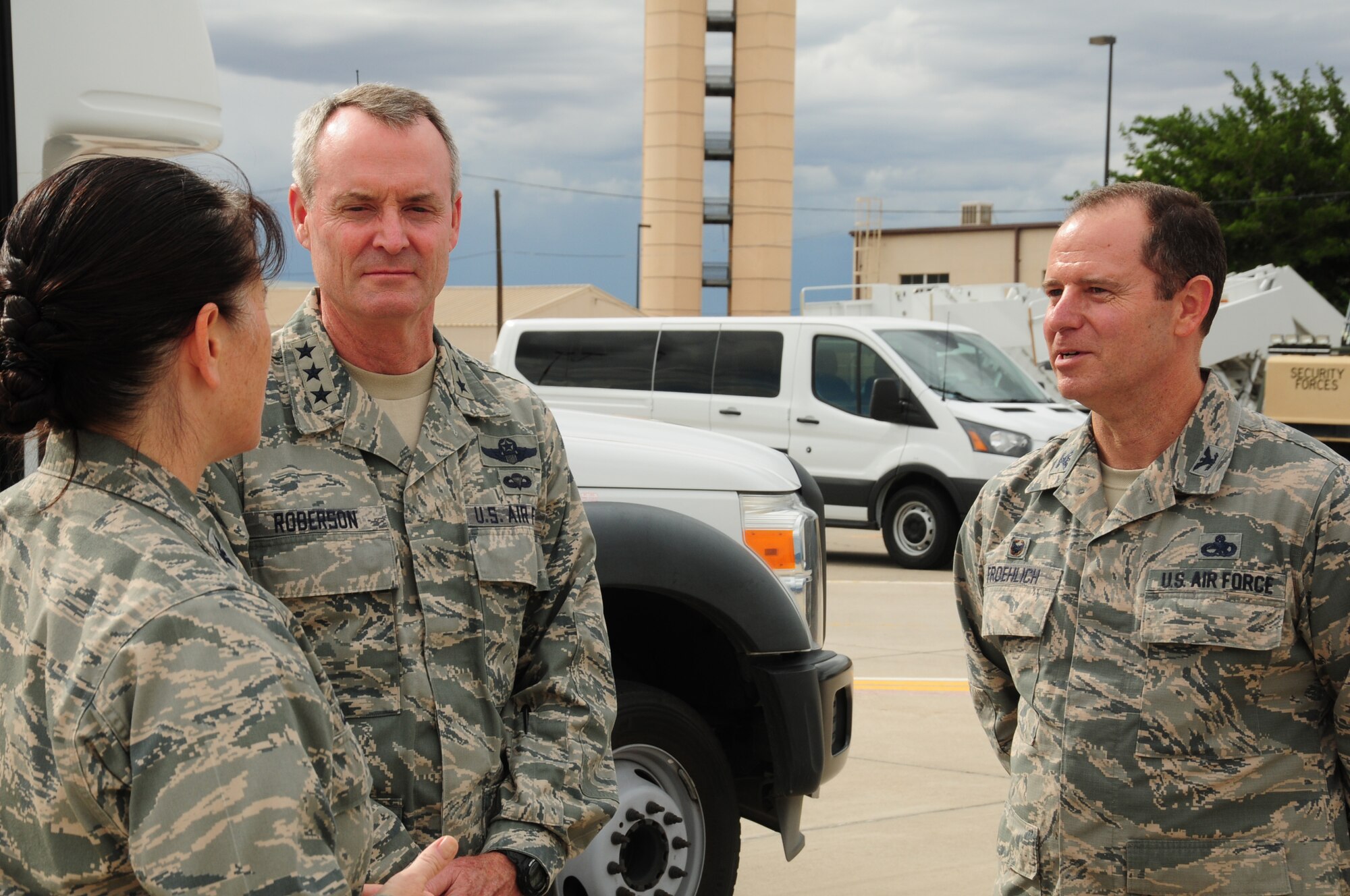 Lt. Gen. Darryl Roberson, commander of Air Education and Training Command, speaks with Col. Eric Froehlich, 377th Air Base Wing commander, and Col. Brenda Cartier, 58th Special Operations Wing commander, prior to his visit to the 150th and 58th Special Operations Wings at Kirtland Air Force Base, N.M., Aug. 5. During his visit, Roberson received an overview of the various mission sets within the wings.  (Photo by Master Sgt. Paula Aragon)