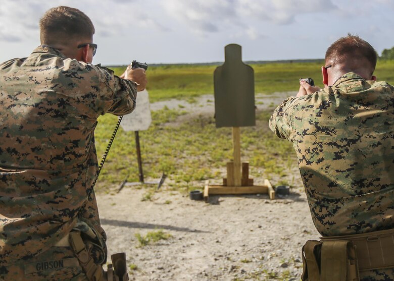 Marines with 2nd Law Enforcement Battalion participated in a Beretta M9 pistol shoot during a weeklong weapon training exercise at Camp Lejeune, N.C., August 9. Marines practiced handling and firing pistols in several unconventional style drills, helping enhance their skills with the weapon. (U.S. Marine Corps photo by Lance Cpl. Aaron K. Fiala)