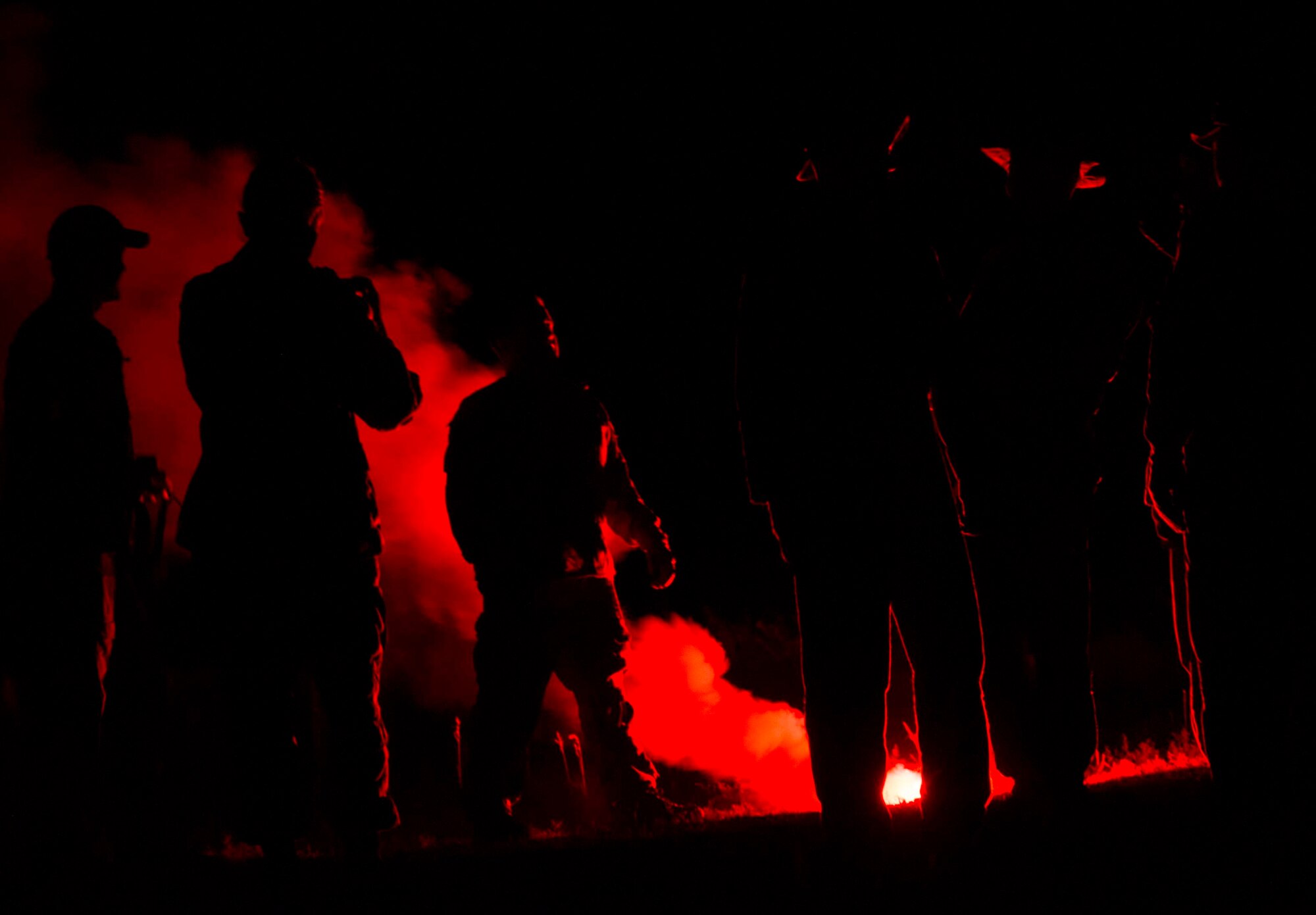 Team Minot Airmen use flares during survival, evasion, resistance and escape training in Garrison, N.D., Aug. 11, 2016. Aircrew members are required to complete SERE training to prepare themselves for potential hostile situations. (U.S. Air Force photo/Senior Airman Apryl Hall)