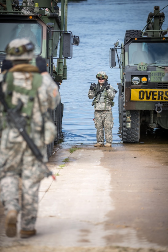 U.S. Army Spc. Adam Fields, 652nd Engineer Company, Ellsworth, Wis., ground guides a Heavy Expanded Mobility Tactical Truck carrying a MK2 Bridge Erection Boat during Combat Support Training Exercise (CSTX) 86-16-03 at Fort McCoy, Wis., August 9, 2016. The 84th Training Command’s third and final Combat Support Training Exercise of the year hosted by the 86th Training Division at Fort McCoy, Wis. is a multi-component and joint endeavor aligned with other reserve component exercises. (U.S. Army photo by Spc. John Russell/Released)8